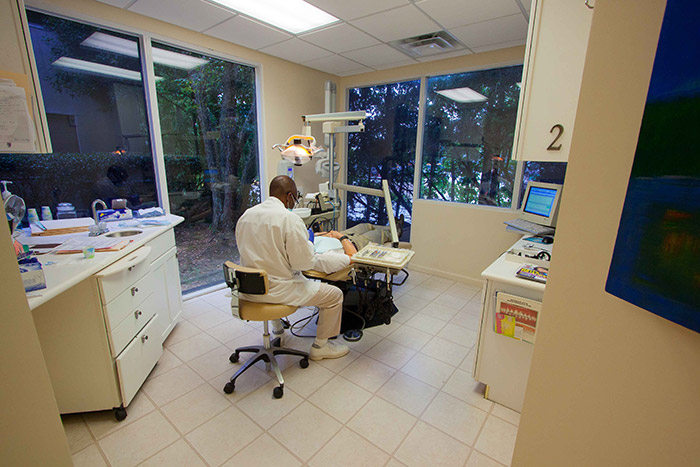 Hygienist cleaning teeth